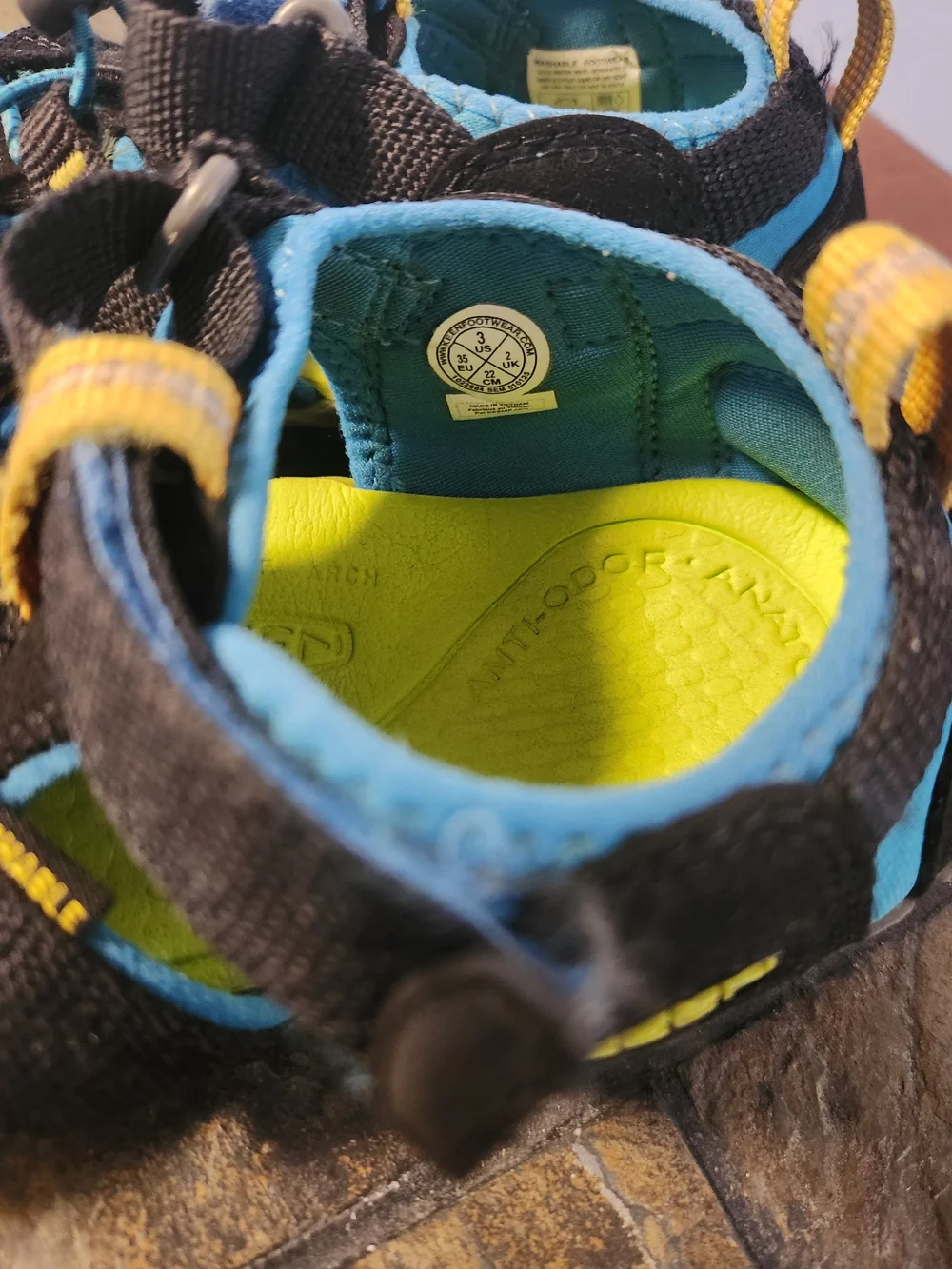 KEEN Kids Black and Blue Closed-Toe CNX Sandals
